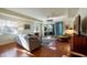 Bright living room with hardwood floors, comfortable seating, and access to patio at 41 Camino Real Blvd # 41, Howey In The Hills, FL 34737
