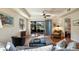 Bright living room with hardwood floors and access to a patio at 41 Camino Real Blvd # 41, Howey In The Hills, FL 34737