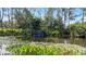 Serene pond with waterfall and lush landscaping at 41 Camino Real Blvd # 41, Howey In The Hills, FL 34737