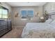 Bedroom with king-size bed and large window at 5047 Meadow Song Dr, Okahumpka, FL 34762