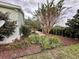 Landscaped side yard with a stone pathway at 558 Saint Andrews Blvd, The Villages, FL 32159