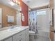 Bathroom includes a shower/tub combo and starfish decor at 5620 Squires Dr, Leesburg, FL 34748