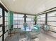 Bright sunroom with glass windows, seating area, and decorative accents at 712 Tarrson Blvd, The Villages, FL 32159
