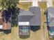 Aerial view showing home's roof, pool, and surrounding houses at 7715 Indian Ridge N Trl, Kissimmee, FL 34747
