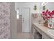 Bathroom with double vanity and walk-in shower at 7715 Indian Ridge N Trl, Kissimmee, FL 34747