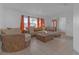 Bright living room with a sectional sofa and access to other rooms at 7715 Indian Ridge N Trl, Kissimmee, FL 34747