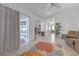 Living room with access to backyard and kitchen view at 7715 Indian Ridge N Trl, Kissimmee, FL 34747