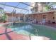 Inviting kidney-shaped pool with patio and lounge chairs at 7715 Indian Ridge N Trl, Kissimmee, FL 34747