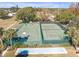 Community tennis and basketball courts with shuffleboard at 7715 Indian Ridge N Trl, Kissimmee, FL 34747