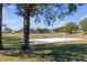 Outdoor community volleyball court with a sandy surface and net at 7715 Indian Ridge N Trl, Kissimmee, FL 34747