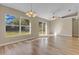 Bright living room featuring a ceiling fan and laminate floors at 12151 Woodglen Cir, Clermont, FL 34711