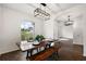 Dining area with rustic farmhouse table and bench seating at 14701 Timucua Pl, Clermont, FL 34711