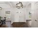 Bright and spacious entryway with wood floors and a chandelier at 14701 Timucua Pl, Clermont, FL 34711