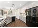 Modern kitchen with stainless steel appliances and gray cabinets at 14701 Timucua Pl, Clermont, FL 34711