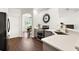 Modern kitchen with stainless steel appliances and gray cabinets at 14701 Timucua Pl, Clermont, FL 34711