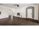 Living room features dark hardwood floors and access to the front entrance at 14701 Timucua Pl, Clermont, FL 34711