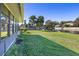 Peaceful backyard with canal views and grassy area at 1621 Texas Ct, Tavares, FL 32778