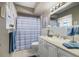 Updated bathroom with a shower/tub combo and white vanity at 1621 Texas Ct, Tavares, FL 32778