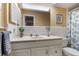 Clean bathroom with white vanity and tiled floors at 1621 Texas Ct, Tavares, FL 32778