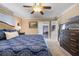 Spacious bedroom with a king-size bed and access to a screened porch at 1621 Texas Ct, Tavares, FL 32778