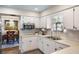 Well-equipped kitchen with white cabinets and stainless steel appliances at 1621 Texas Ct, Tavares, FL 32778
