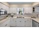 Clean kitchen featuring white cabinets, and stainless steel appliances at 1621 Texas Ct, Tavares, FL 32778