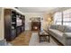 Living room with hardwood floors, fireplace, and comfy seating at 1621 Texas Ct, Tavares, FL 32778