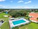 Resort-style community pool, clubhouse, and tennis courts at 17552 Se 96Th Ct, Summerfield, FL 34491