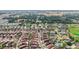 Aerial view of a community with houses and green spaces at 2380 Bachman Path, The Villages, FL 32162