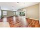 Dining room with hardwood floors and sliding glass doors to backyard at 2380 Bachman Path, The Villages, FL 32162