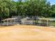 Baseball field with dugouts and a grassy outfield at 26613 Racquet Cir, Leesburg, FL 34748