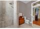 Elegant bathroom with walk-in shower and antique vanity at 307 Shadow Harbour Ln # 307, Mount Dora, FL 32757