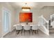 Bright dining room with modern table and chairs, near staircase at 4094 Lana Ave, Davenport, FL 33897