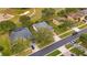 Aerial view of houses in a residential neighborhood next to a golf course at 4236 Fawn Meadows Cir, Clermont, FL 34711