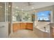 Elegant bathroom with double vanity, soaking tub, and walk-in shower at 4236 Fawn Meadows Cir, Clermont, FL 34711