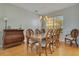 Formal dining room with a wood table and chairs, and a wood dresser at 4236 Fawn Meadows Cir, Clermont, FL 34711