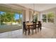 Bright dining room with sliding doors leading to the pool area at 4236 Fawn Meadows Cir, Clermont, FL 34711