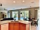 Kitchen island with granite countertops and views of the pool at 4236 Fawn Meadows Cir, Clermont, FL 34711