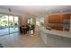 Kitchen with island, granite counters, and views of the pool at 4236 Fawn Meadows Cir, Clermont, FL 34711