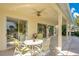 Covered patio with seating area and ceiling fan at 4236 Fawn Meadows Cir, Clermont, FL 34711