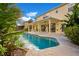 Relaxing freeform pool with a large patio area at 4236 Fawn Meadows Cir, Clermont, FL 34711