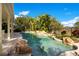 Resort-style pool with rock waterfall feature at 4236 Fawn Meadows Cir, Clermont, FL 34711