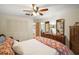 Bedroom with large closet, dresser, and a comfortable bed at 5319 Eagles Nest Rd, Fruitland Park, FL 34731