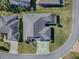 Aerial view showing house layout, backyard, and driveway at 632 Kauska Way, The Villages, FL 32163