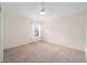 Empty bedroom with ceiling fan, window with curtains, and carpeted floor at 8827 Se 168Th Tailfer St, The Villages, FL 32162