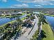 Gated entrance to community with palm trees and water features at 955 Ladera Ranch Rd, Kissimmee, FL 34759