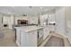 Island kitchen with stainless steel appliances and breakfast bar at 955 Ladera Ranch Rd, Kissimmee, FL 34759