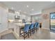 Modern kitchen with island and breakfast bar seating at 955 Ladera Ranch Rd, Kissimmee, FL 34759