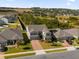 Aerial view of a two-story house with a gray exterior and a large backyard at 1150 Blarney St, Minneola, FL 34715