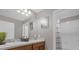 Modern bathroom with double vanity and shower at 1150 Blarney St, Minneola, FL 34715